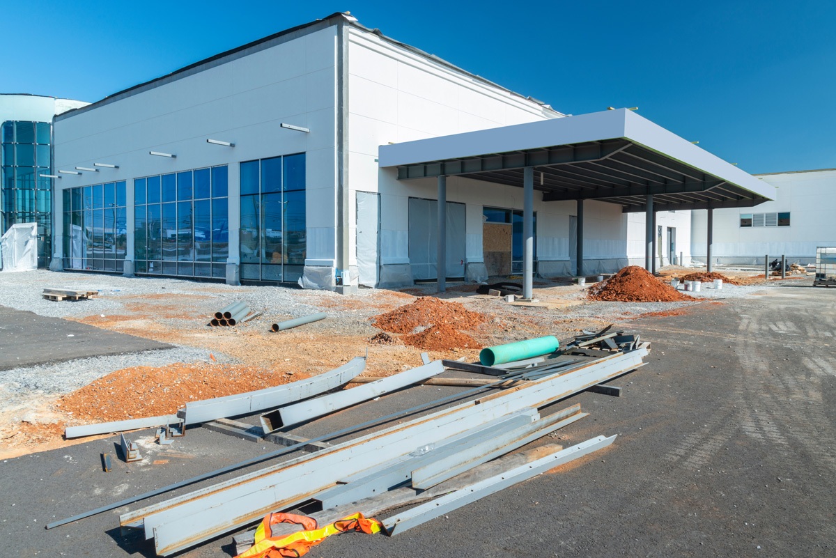 A white government building in the construction process in Carlsbad.